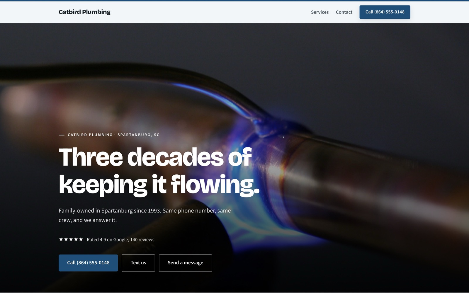 The Catbird Plumbing demo site on a desktop: a soldering torch photo behind the headline Three decades of keeping it flowing, with call and text buttons.
